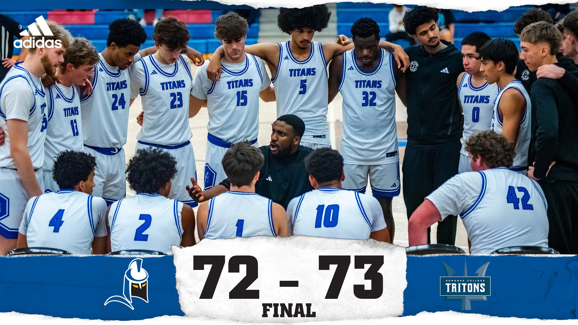 The Titans huddle around their coach with the final score below.